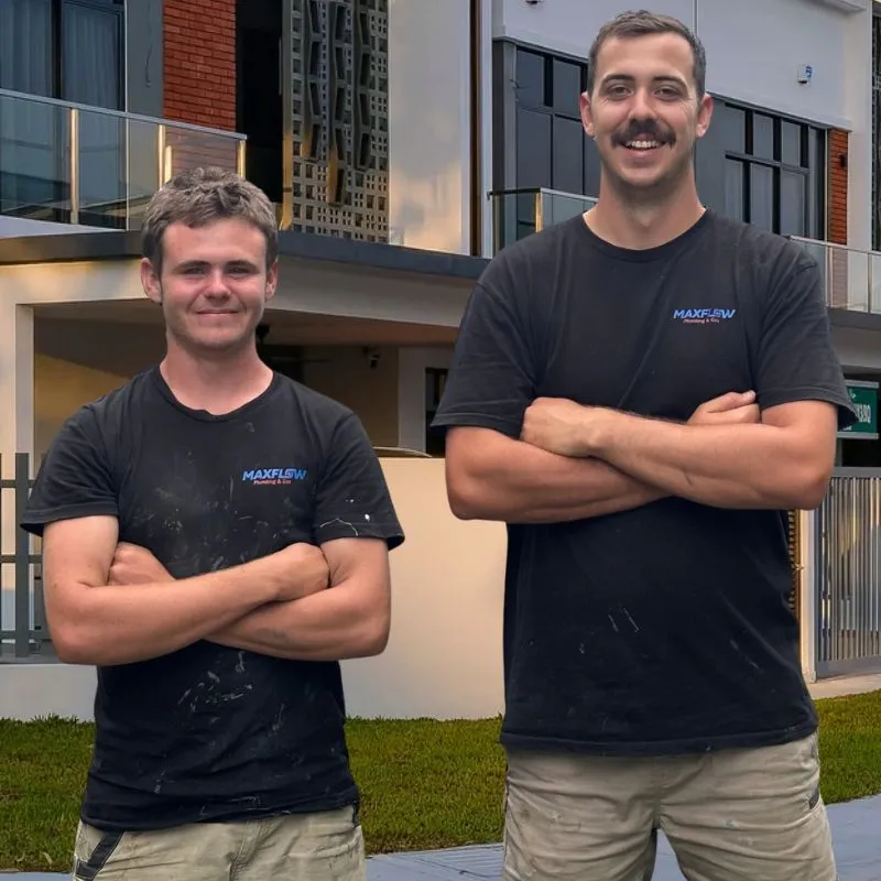 The Maxflow Plumbing and Gas team standing outside a home